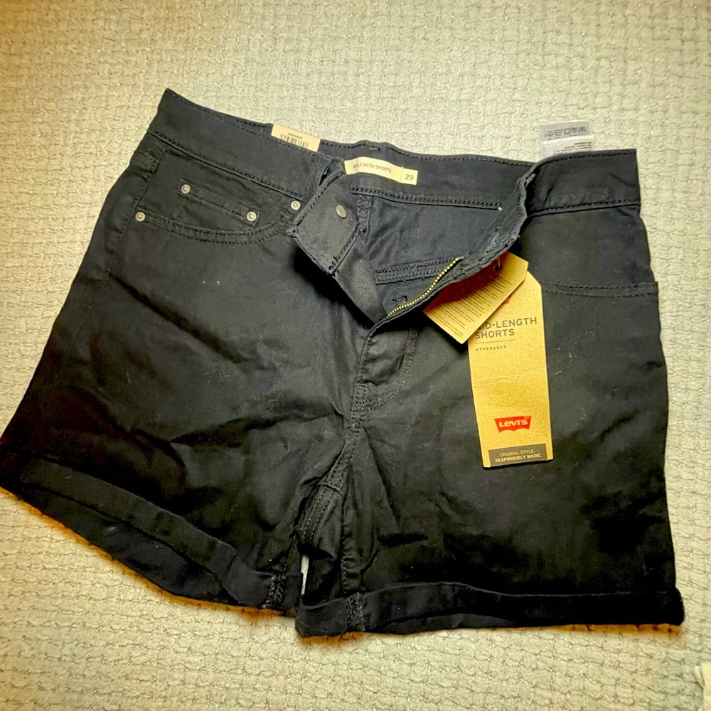 Levis black roll up mid length shorts. Size 29